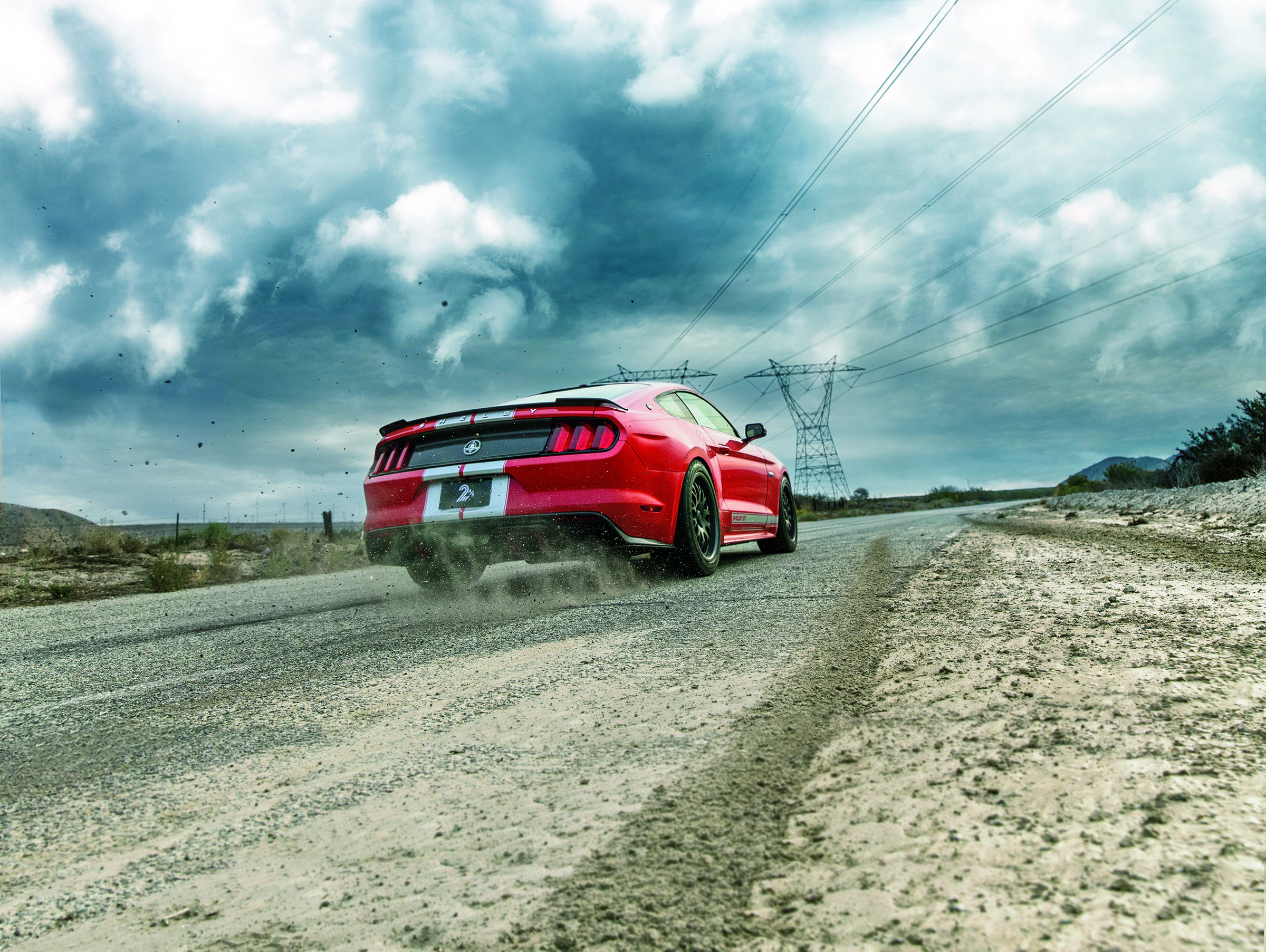 red car on gravel road
